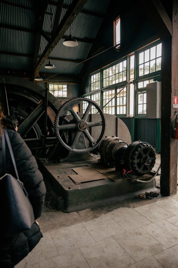 Vintage mining machinery inside an industrial museum showcasing historical technology.