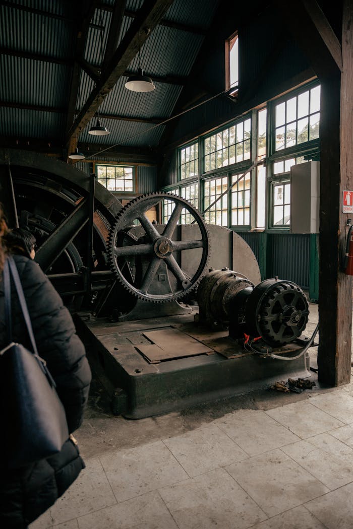 Vintage mining machinery inside an industrial museum showcasing historical technology.