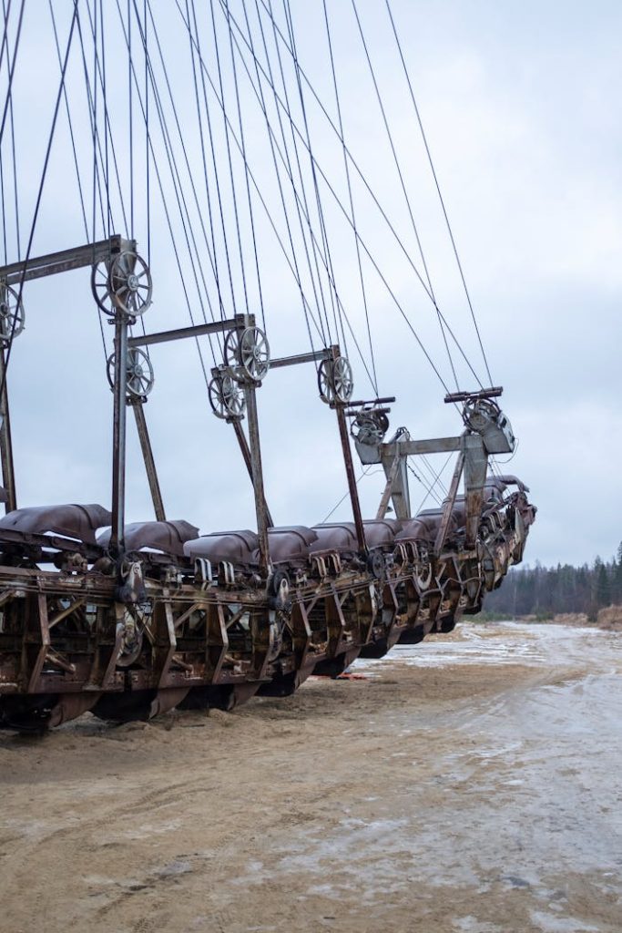 A large, rusty excavator in an outdoor mining site in Voskresensk, Russia, showcasing industrial machinery.
