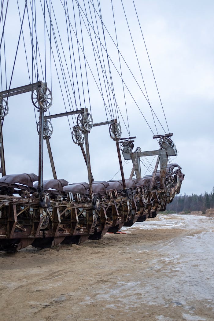 A large, rusty excavator in an outdoor mining site in Voskresensk, Russia, showcasing industrial machinery.